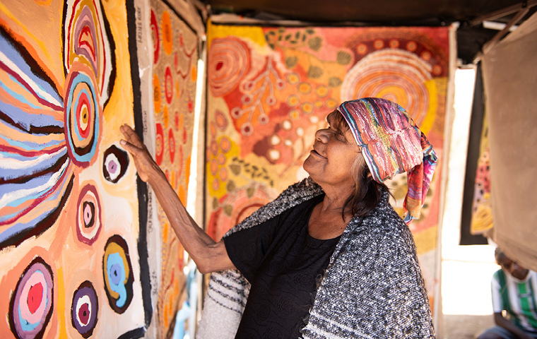 1. Wanatjura Lewis of Tjala Arts, Amata, at the Desert Mob 2024 Marketplace. Photo by Sara Maiorino. Courtesy Desart